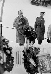 A Father and Son Give a Salute at the Grave of J.F. Kennedy, Washington